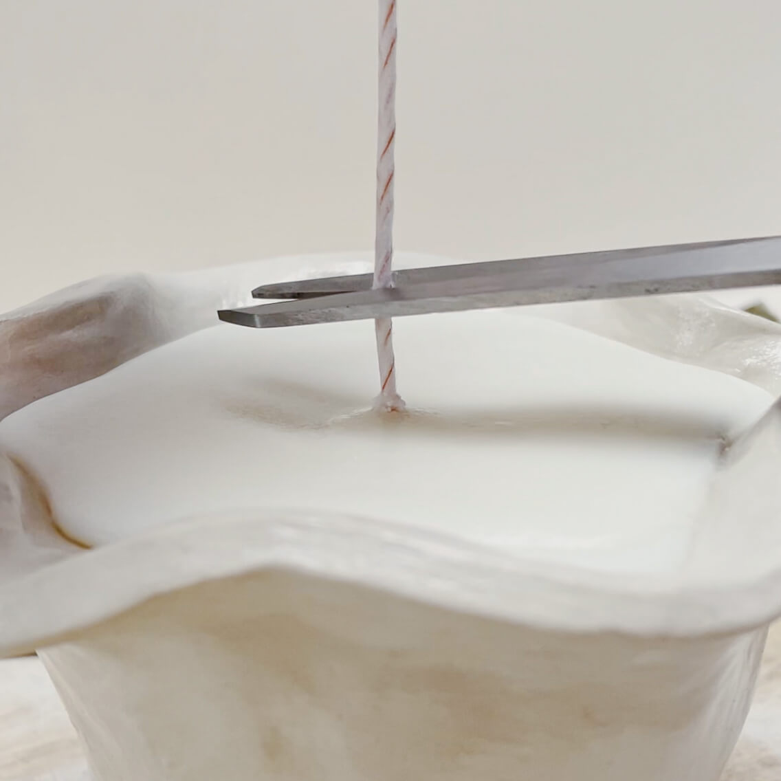 Your 9 step candle making journey - Allow to cool and snip wick