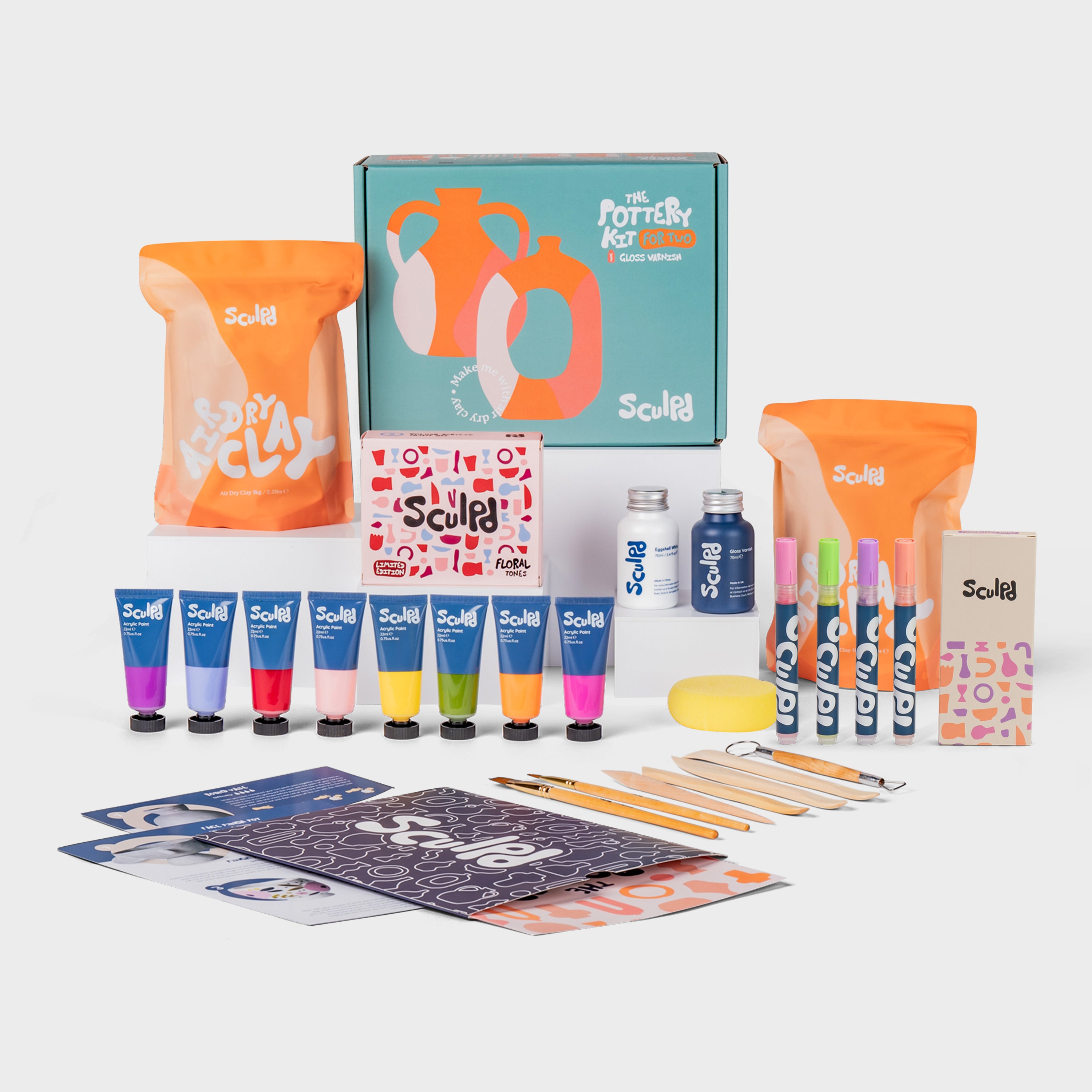 Sculpd pottery kit for two green box with floral paints, and modernist pens set