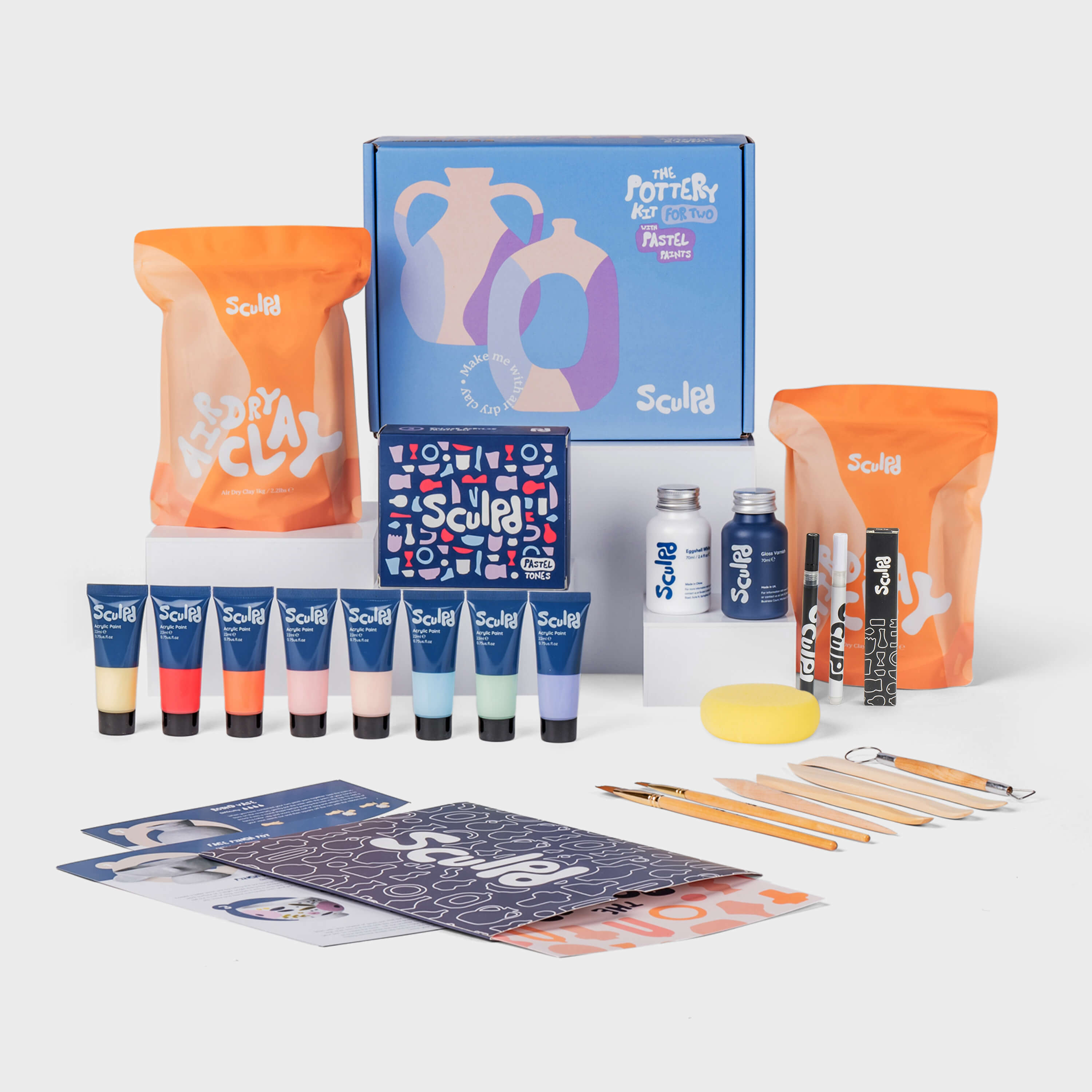 Sculpd pottery kit for two in light blue box with pastel paints, and fine tip pens set