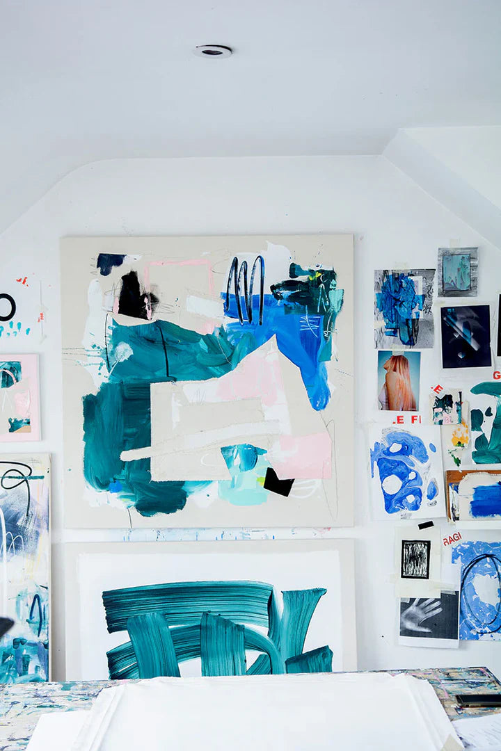 Abstract paintings in shades of pinks and blues displayed on a wall made using Sculpd Canvas Painting Kit 