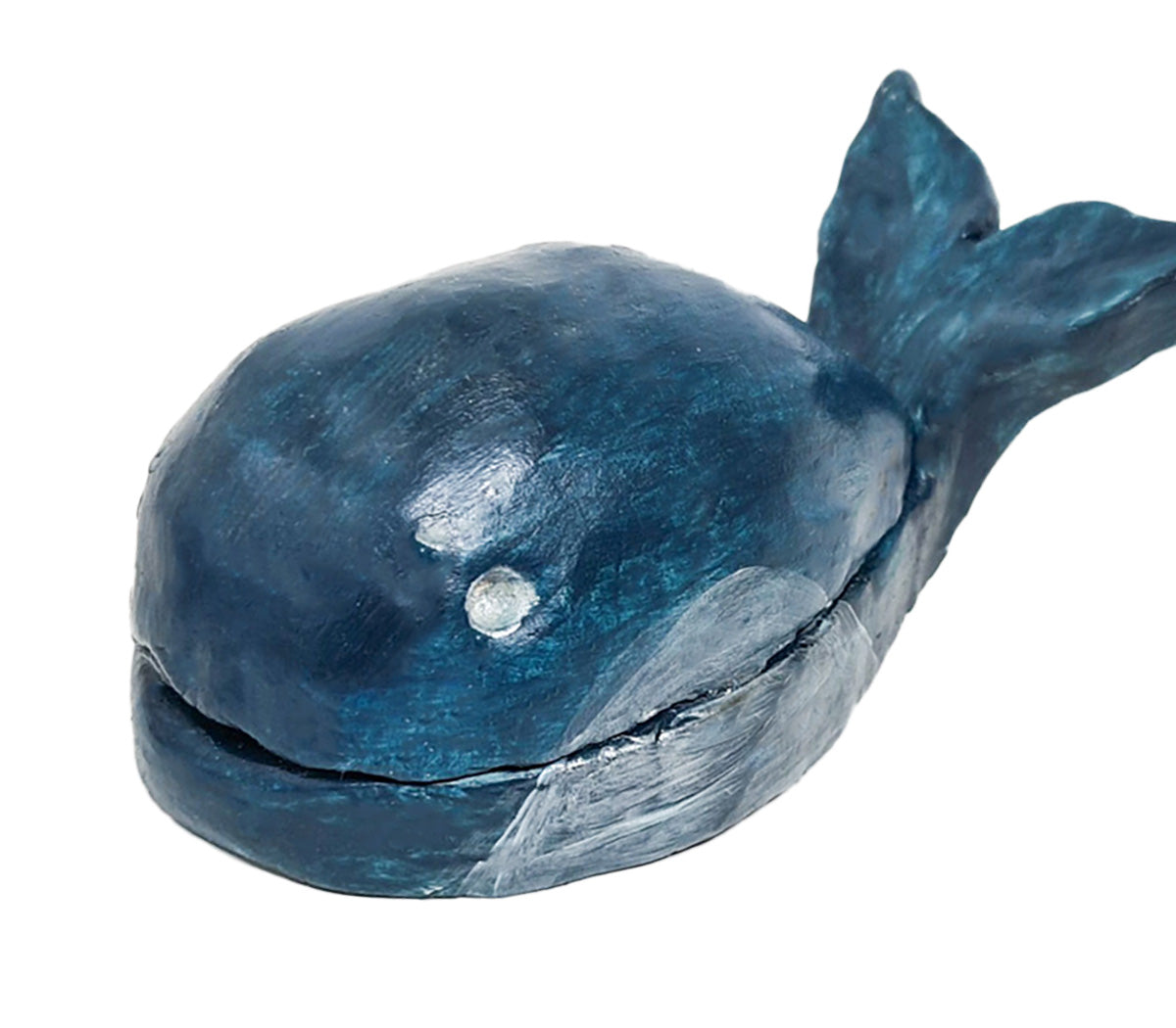 A handcrafted clay killer whale figurine, painted in blue accents and a smiling face made from Sculpd Kids Pottery Kit